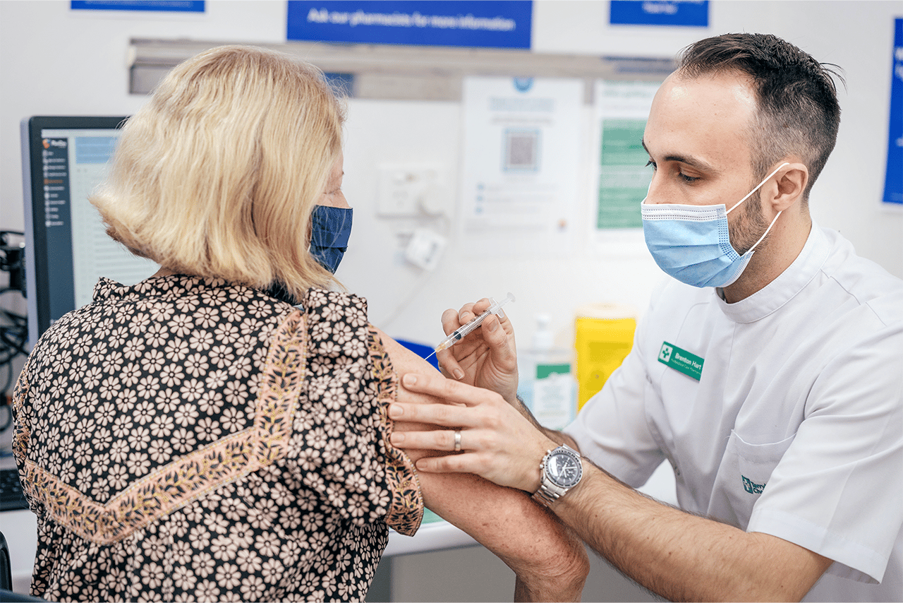 TerryWhite Chemmart customer receiving Flu shot from our chief pharmacist